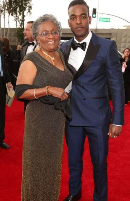 Singer Luke James with his mother